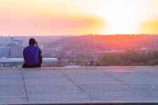 Hutchinson: Sunset, Kansas City, man on stairs